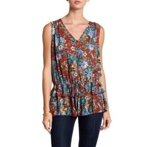 Pleione Sleeveless Ruffle Peplum Floral Blouse
